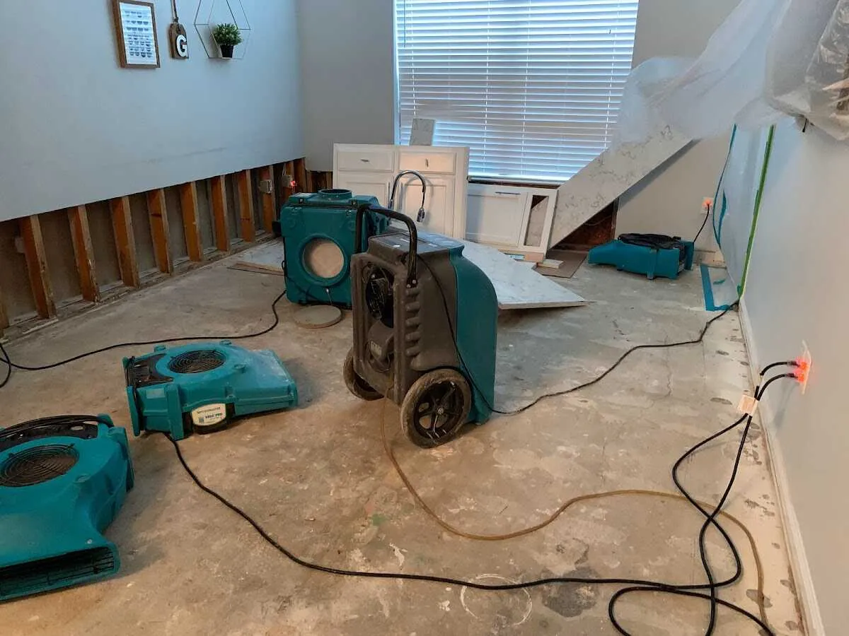Dehumidifier in flood-cut room for Water Damage Restoration in Spring Creek